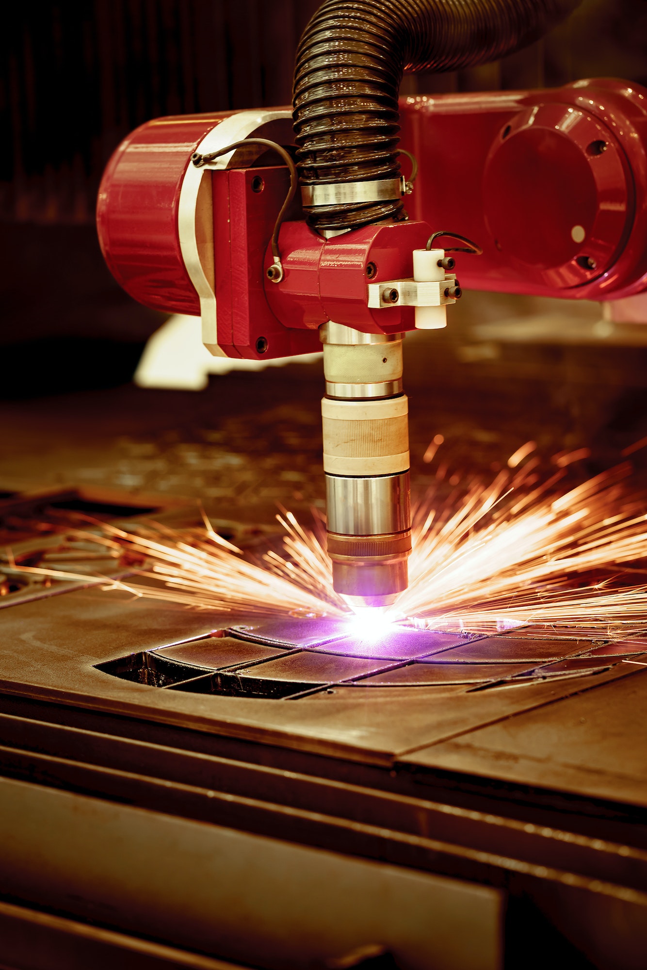 CNC Laser plasma cutting of metal, modern industrial technology.